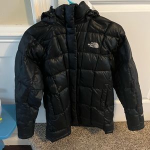 The North Face black puffer jacket in size XS/S